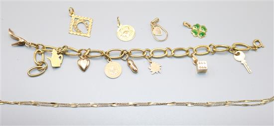 A gold bracelet and charms